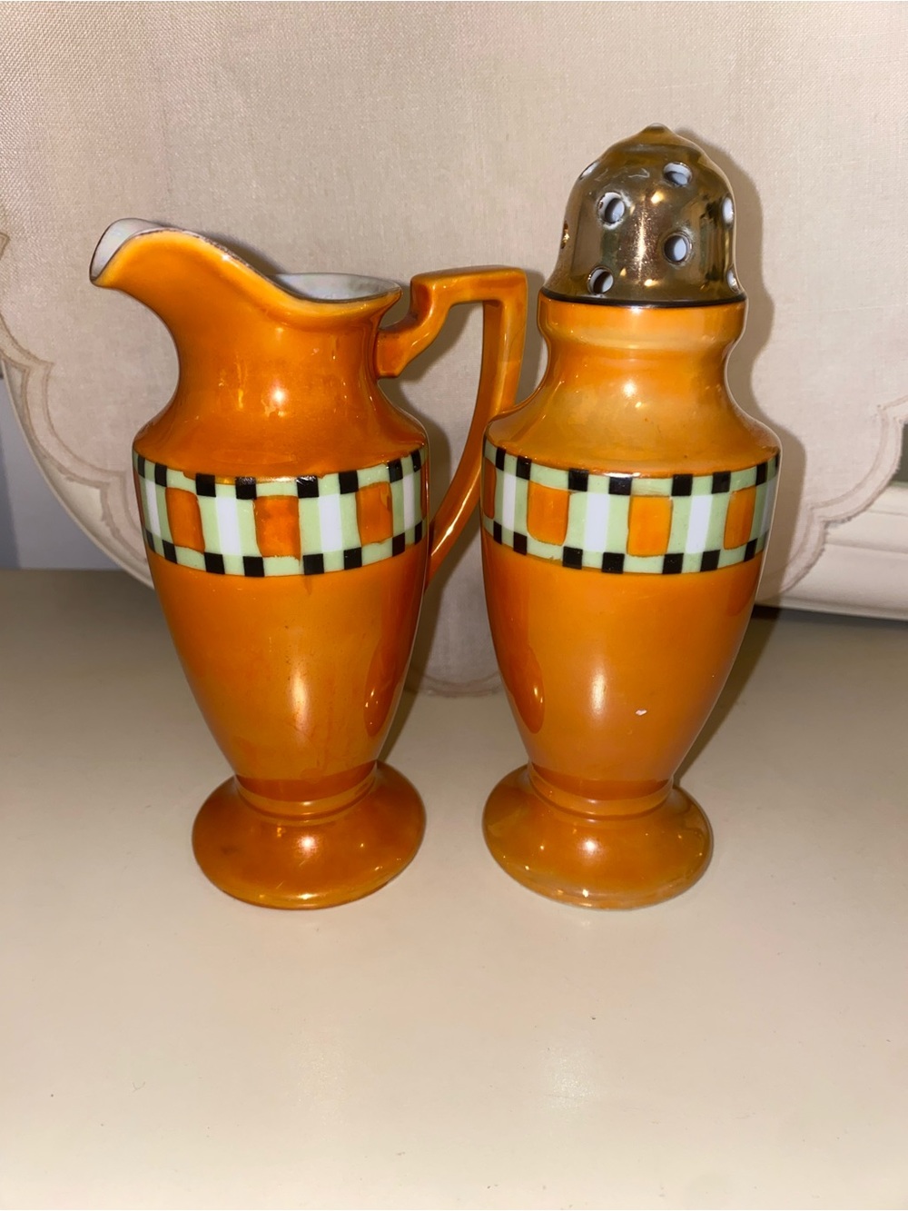 Noritake Orange Ceramic Creamer and Shaker Set with Checkered Band